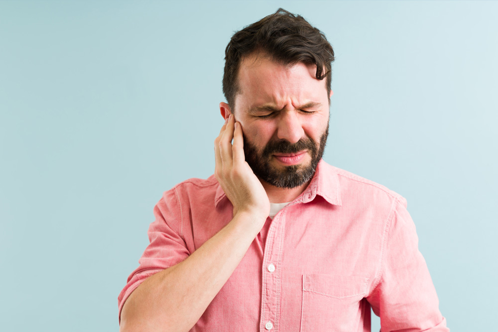 It may sound improbable, but it’s a reality – nearly 50% of individuals experiencing ear pain find its root cause in jaw and teeth issues. Scientifically, jaw joint and bite problems have been identified as contributors to tinnitus, the persistent ringing or humming noise